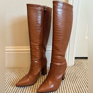 She&in tan knee high boots